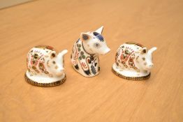 A group of three Royal Crown Derby bone china paperweights, Sitting Piglet having gold coloured