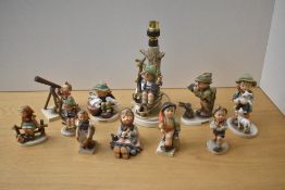 A group of eleven vintage Goebel porcelain figures/figurines including 'Merry Wanderer' model number