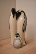 A Moorcroft Pottery emperor penguin group C2009, signature to base, measuring 17cm tall. Complete