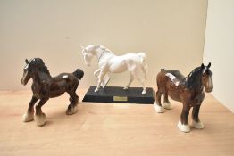 Three Royal Doulton bone china horse studies comprising 'Spirit of Freedom', and two Shires in brown
