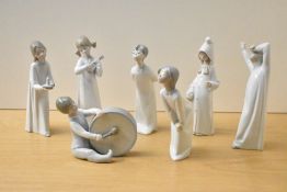 A group of seven Lladro porcelain figures and figurines including 'Boy with Drum' model number 4616,