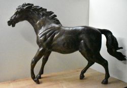 A large brass horse study, measuring 66cm x 99cm, having slight oxidisation in places.