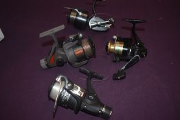 Four spinning reels including Silstar fx50, Mitchell 330, Crystal river executive 520ep and a Matt