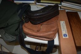 A collection of two leather cartridge bags five cartridge belts and three gunslips along with a