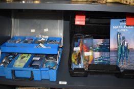 Two hand held tackle boxes containing mixed tackle including jelly lures and a lot of large weights