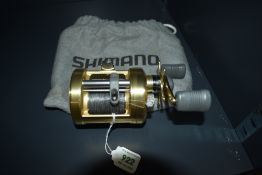 A Shimano Calcutta 400 Baitcasting Reel in original soft pouch