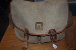 A canvas Hardy fishing bag with some general fishing tackle inside 34cm x 38cm approx