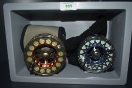 Two unbranded alloy fly reels one measuring three and three quarter inch and the other four inches