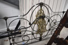 A Victorian style cast iron four poster double bed frame and base