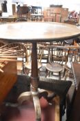 A 19th Century mahogany pedestal table having turned column and triple splay legs