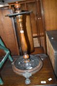 A Victorian style mahogany stick stand having weighted base