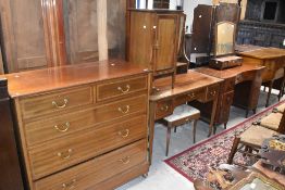 An Edwardian mahogany part bedroom suit comprising dressing table, pot cupboard, and chest of two