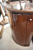 An early 20th Century mahogany bow fronted corner wall cupboard, height approx. 100cm