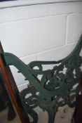 A pair of ornate cast iron bench ends