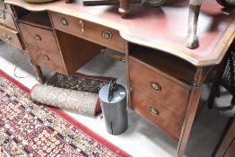 An early to mid 20th Century mahogany desk or dressing table having shaped front, lock stamped IWS
