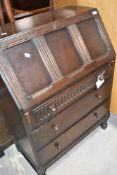 A Priory style oak bureau