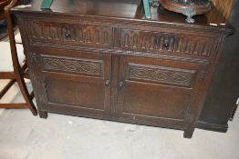 A priory style dark oak sideboard, width approx. 122cm