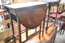 An early 20th Century mahogany gateleg occasional table