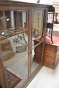 An early 20th Century oak full height bookcase, dimensions approx. 167 x 143 x 38cm
