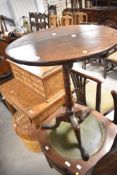 A 19th Century oak snap top occasional table having circular top and triple splay legs, diameter
