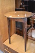 A 19th Century 'cricket' style table having mahogany circular top on typical stained frame typical