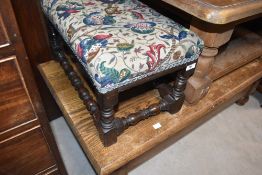 An oak footstool having turned frame, approx. 53 x 31cm