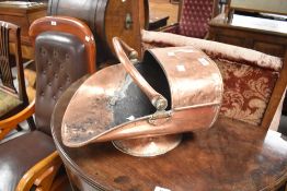 An antique copper coal helmet