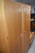 A vintage golden oak wardrobe and dressing table, labelled Meredew