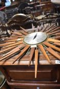 A vintage teak 'starburst' clock, dial named for Seth Thomas , some 'rays' missing