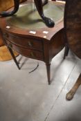 A reproduction Regency style occasional table having circular inset skiver top and two frieze