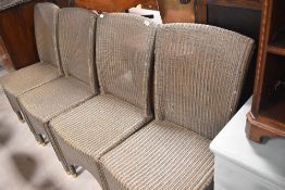A set of four Lloyd Loom style garden or conservatory chairs, labelled Vincent Shepherd
