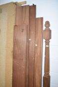 An untreated wooden four poster bed, possibly mahogany , dismantled