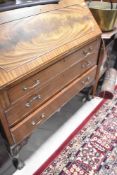 An early 20th Century bureau, on ball and claw feet, width approx. 107cm