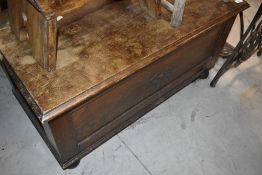 A traditional stained frame bedding box
