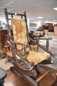 A Victorian mahogany childs American style rocking chair