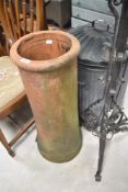 A clay chimney pot, height approx. 67cm