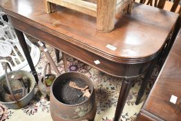 A Victorian mahogany fold over tea table