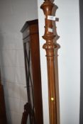 An early to mid 20th Century mahogany standard lamp on fluted column and triple splay carved legs