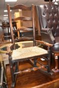 A 19th Century rush seated ladderback rocking chair