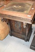 A 19th Oak davenport desk having heavily carved decoration and gallery