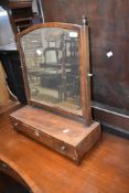 A 19th Century mahogany toilet mirror having drawer base