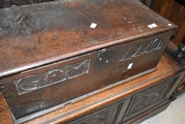 A period oak box having hinged lid and cast lock front, monogram GM , dated 1750, approx