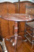 A 19th Century mahogany pedestal table having oval top , turned column and triple splay legs,