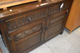 A Priory style oak sideboard base, width approx. 122cm