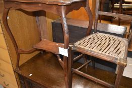 An early 20th Century mahogany occasional table having shaped top and undertier , and a cane