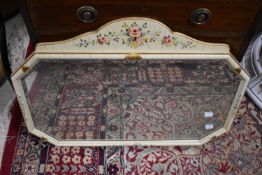 A vintage wall mirror having foliate painted decoration