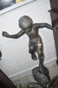 A bronzed garden ornament/water feature modelled as boy on snail,height to base approx. 75cm