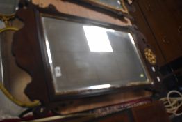 A 19th Century Chippendale style wall mirror with gilt heightened decoration, approx. 93 x 49cm