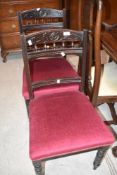 A pair of Victorian dark stained salon/dining chairs having rail and spindle back with after