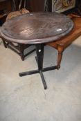 A circular cafe style table having metal frame
